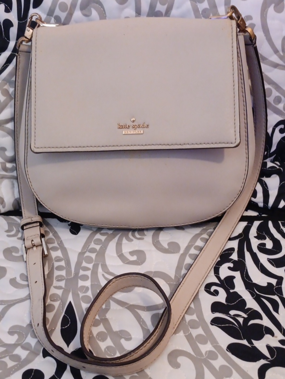 kate spade cream saddle crossbody with gold-tone logo
